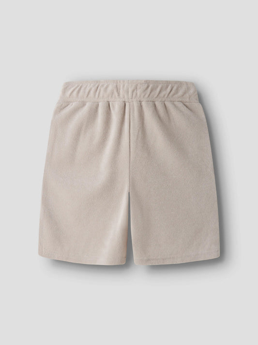 Beige mjuk och skön frotté shorts till pojke. Sköna mjuka frotte shorts till kille barn och ungdom från Name it.
NKMFINTI NREG TERRY SHORTS BOX
13257499