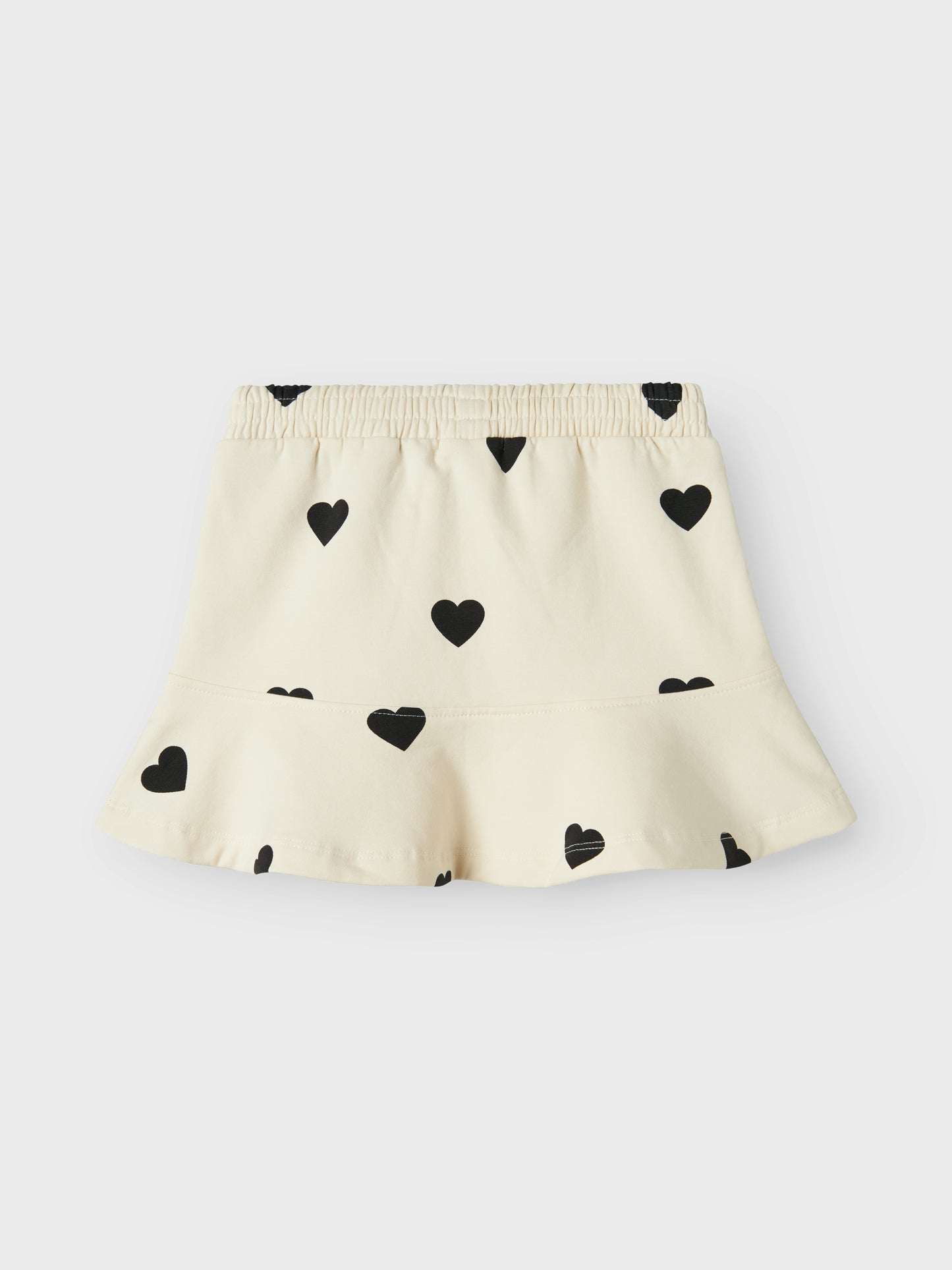 Vit barn kjol i ekologisk bomull med svart hjärtan. Tuff och samtidigt söt kjol till flicka, tjej från Nameit. Fira festliga tillfällen eller vardag med trendiga kjolar som ger dig frihet att röra dig och leka. Borstad sweatshirt har en mjuk insida för en bekväm känsla.
Produkttyp: Kjol
Längd/Storlek: Kort
Extra detaljer: Peplumdetalj
Mönster: Hjärta upprepas över hela produktens yta