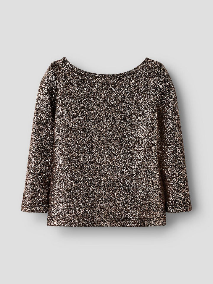Svart guld glitter topp med rosett bak i nacken. Söt festlig tröja till flicka från Name it.
NMFDITSA LS TOP
13256276