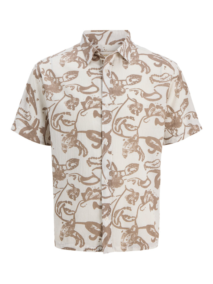 Vit och beige mönstrad skjorta till pojke. Kortärmad blommig sommar skjorta till kille, barn och ungdoms skjortor från Jack and Jones
JORMONTAUK AOP SHIRT SS JNR
12293813