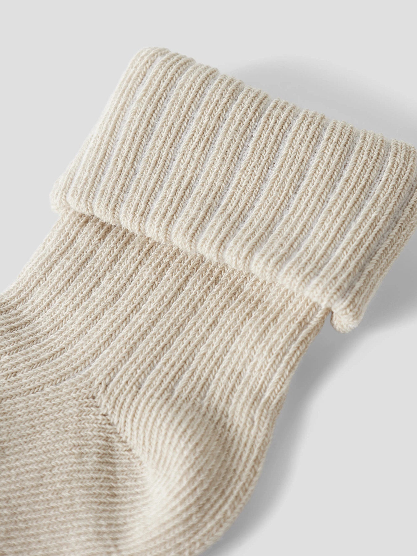 Ljus beige vita baby strumpor till flicka. Bebis strumpor till nyfödd baby flicka från Name it.
NBFNOBBA SOCK
13207439
