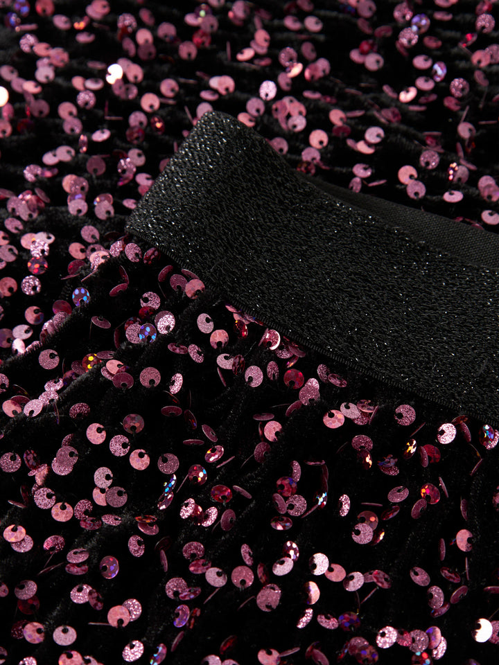 Runica paljettkjol från Name It i svart med vinröda och rosa paljetter samt glittrig resårmidja.