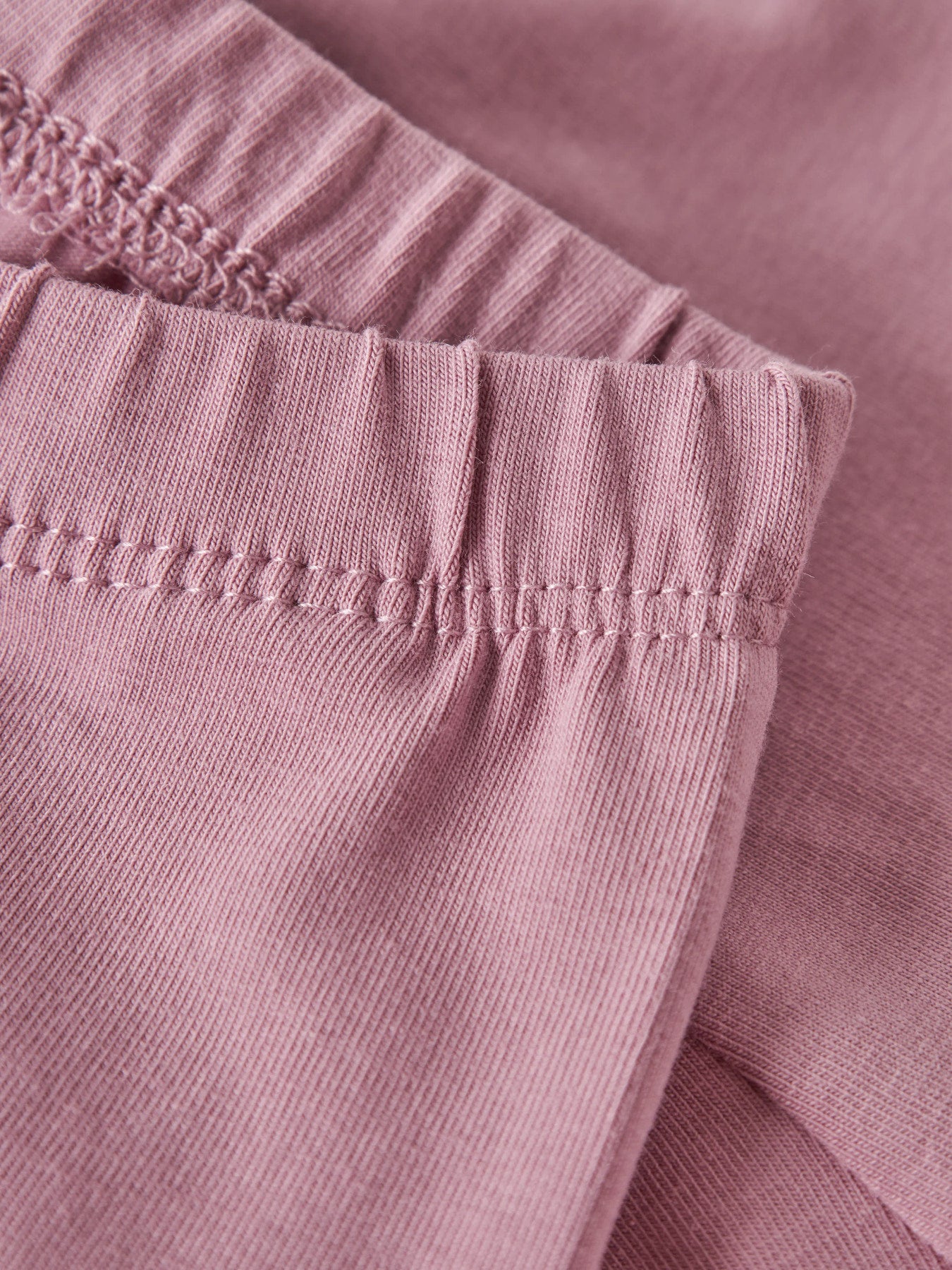 Name It Vuvivian gammelrosa babyleggings i ekologisk bomull med elastisk midja.
