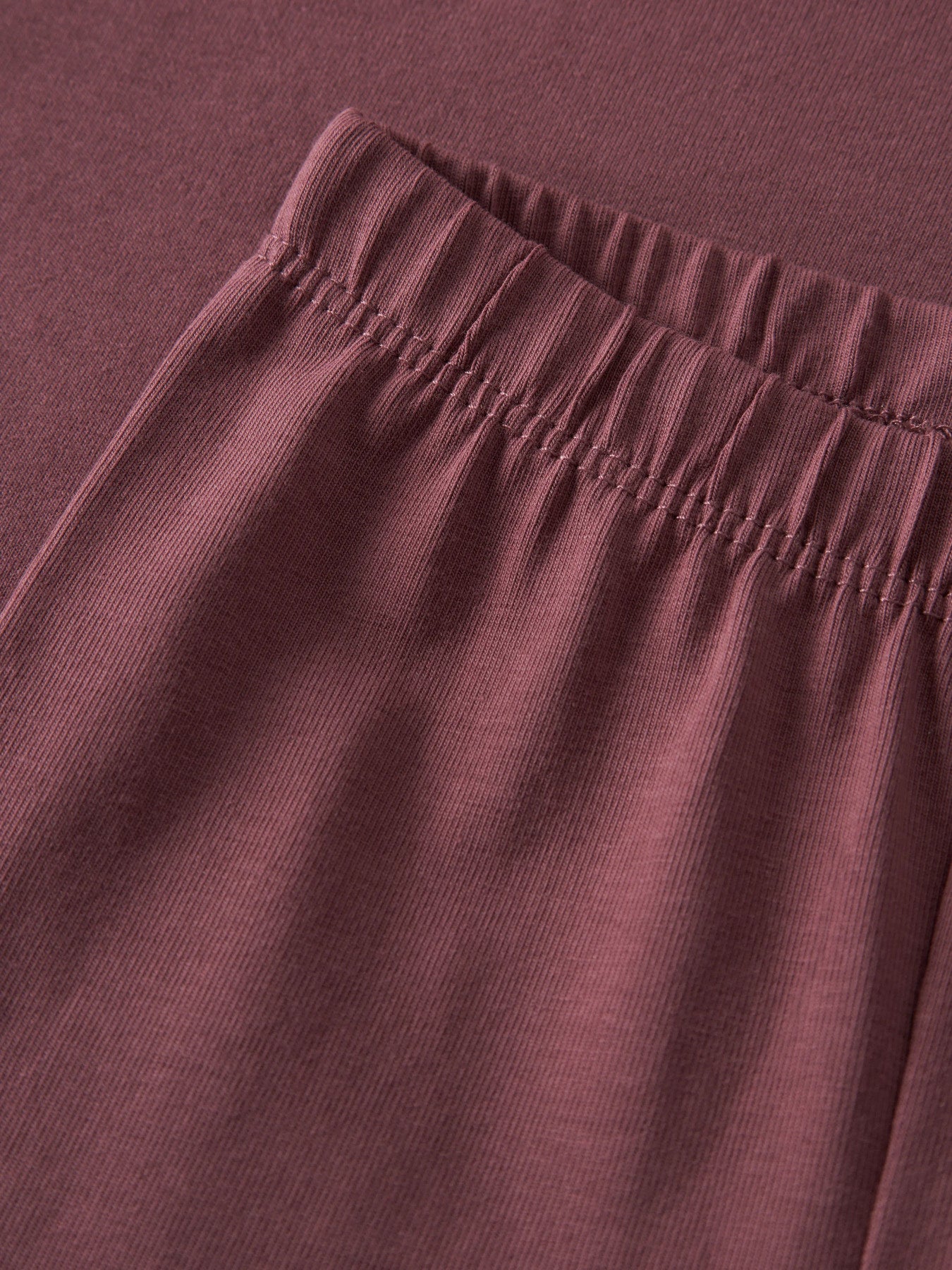 Name It Vuvivian ginger röd babyleggings i ekologisk bomull med elastisk midja.