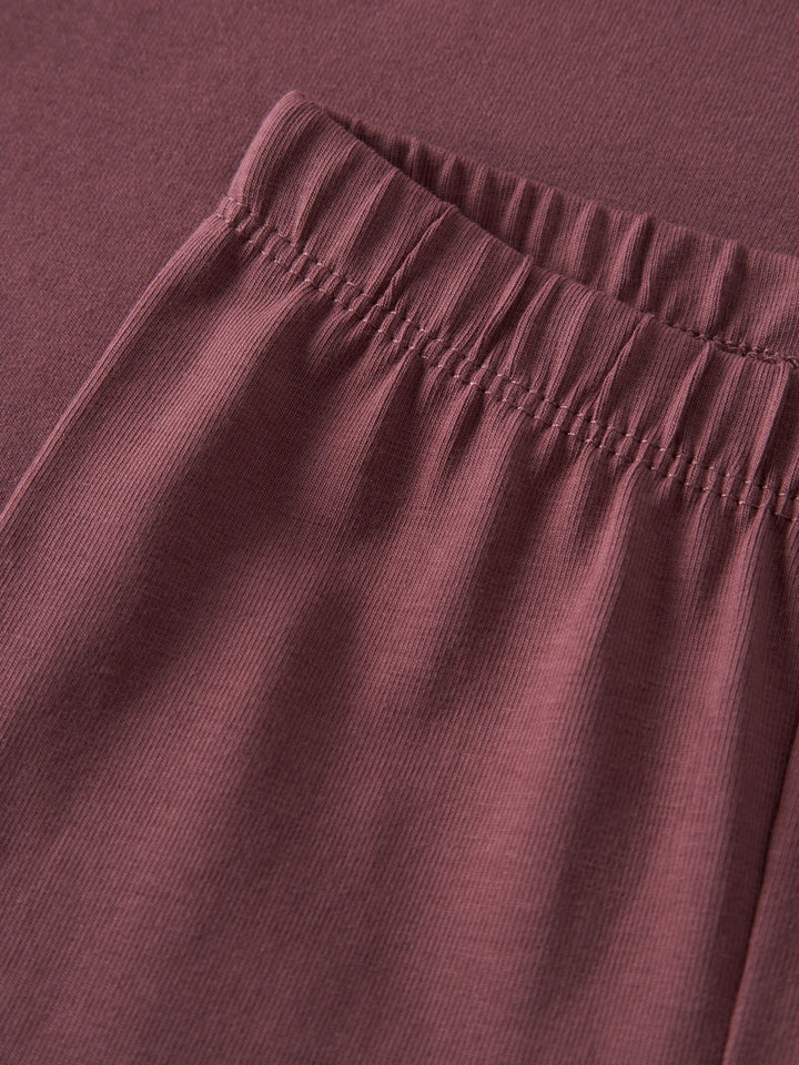 Name It Vuvivian ginger röd babyleggings i ekologisk bomull med elastisk midja.