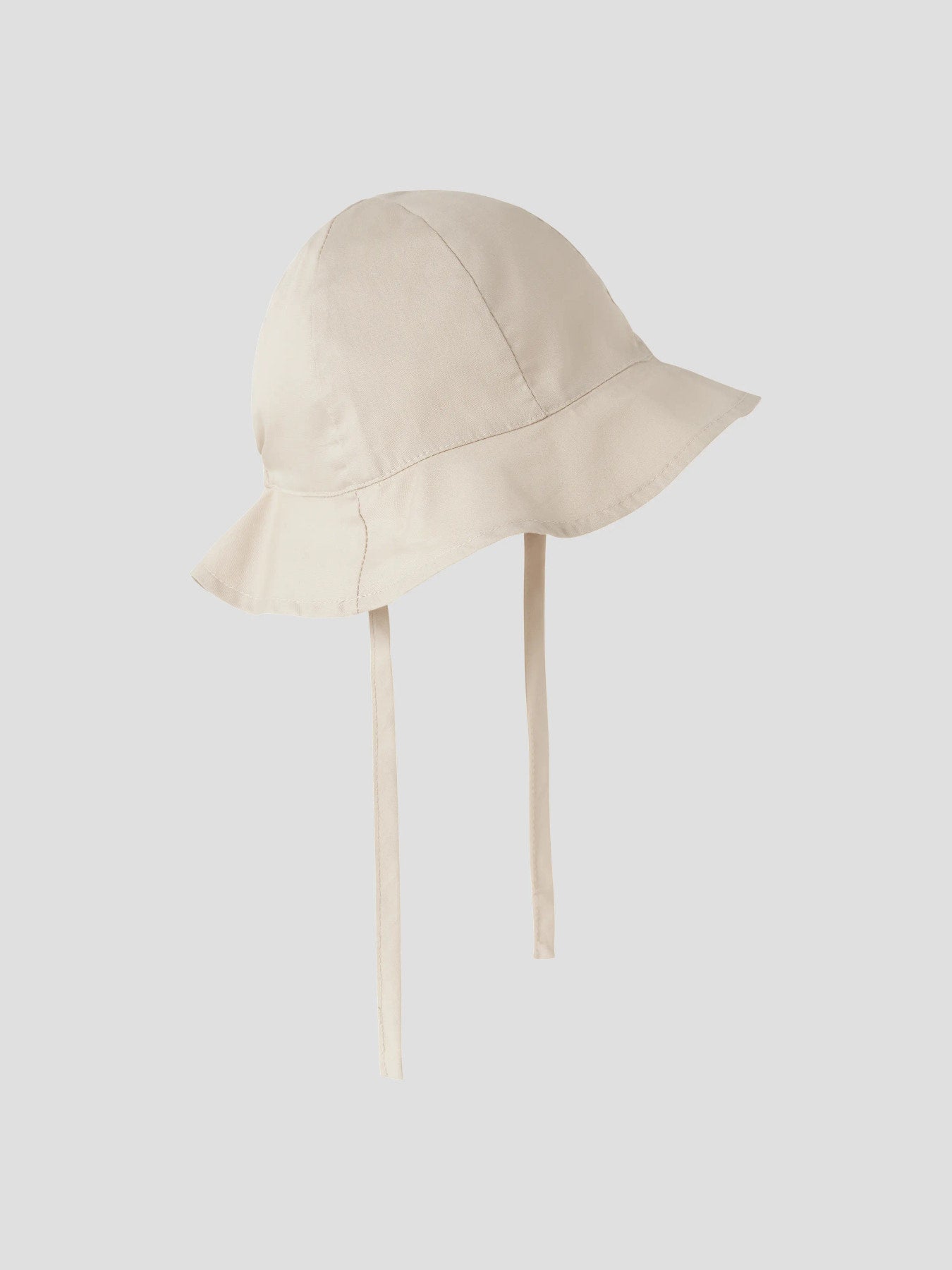 Beige enfärgad solhatt till bebis pojke och flicka. Baby uv hatt som skyddar din lilla bebis mot solens strålar. 
NBNZILU UV HAT W/ EARFLAPS
13226586