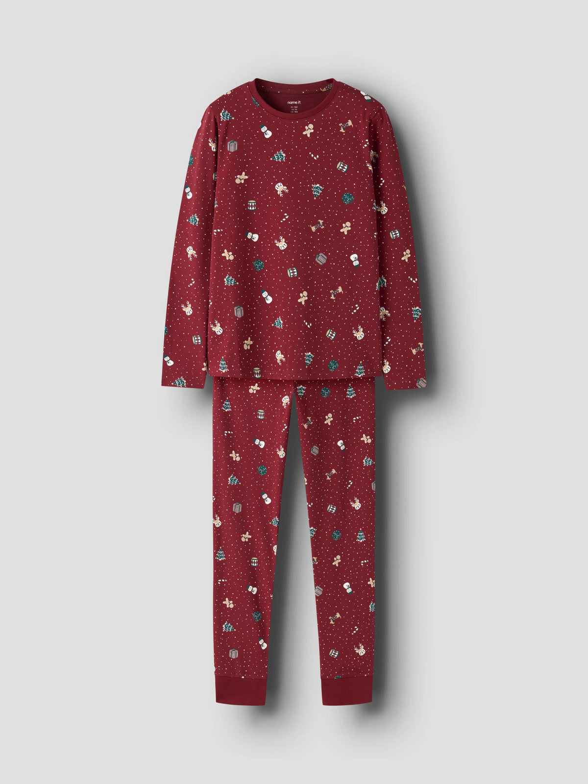 Ismas julpyjamas med långärmad tröja och byxor i rött med julmotiv till flicka och pojke.