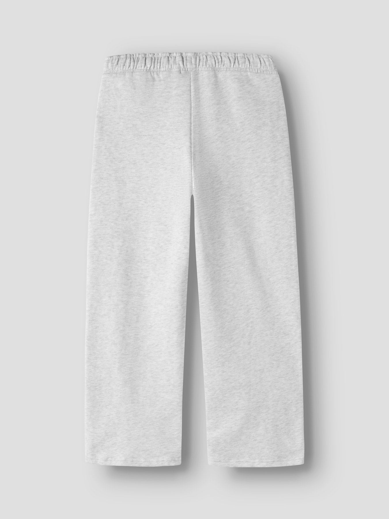 LMTD låg ljusgrå vida sweatbyxor för ungdom tjej i ekologisk bomull och återvunnen polyester med elastisk midja och mjuk sweatkvalitet