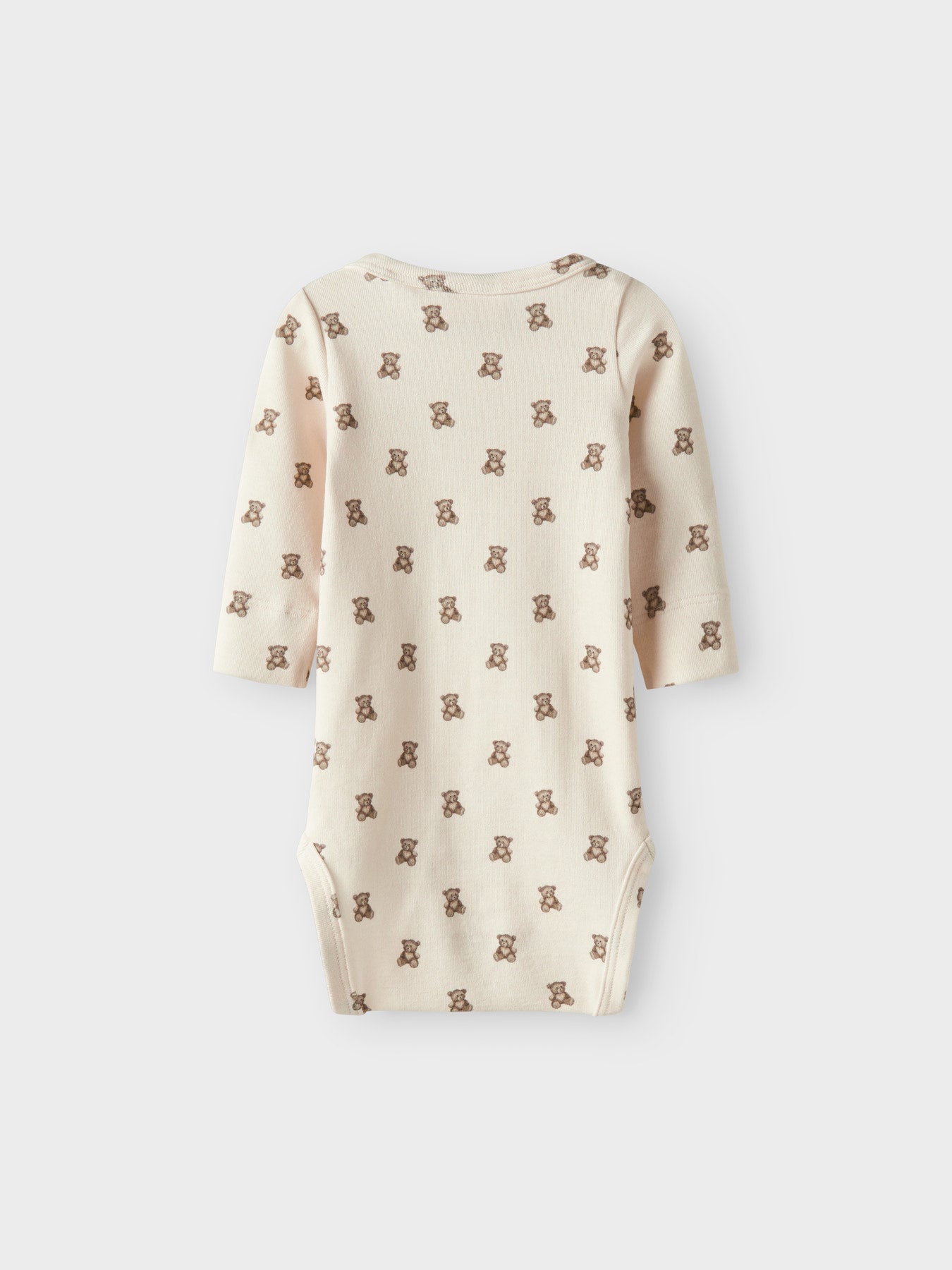 Lil' Atelier beige body med nallemönster för baby unisex i ekologisk bomull och TENCEL™ Lyocell med tryckknappar och mjuk stretchkvalitet