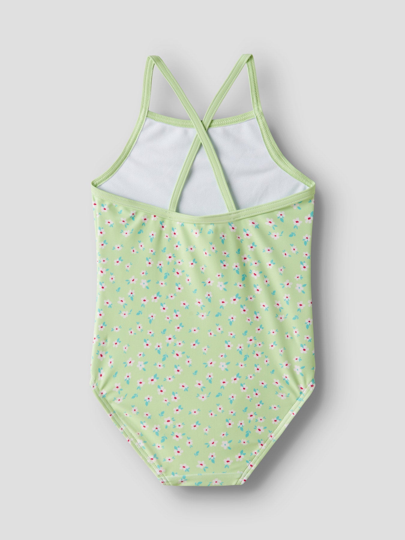 Små blommig söt grön baddräkt med korsade axelband till flicka. Badkläder från Name it, baddräkt mönstrad färgglad till flicka.
NMFZIZLA SWIMSUIT BOX TB
13251615