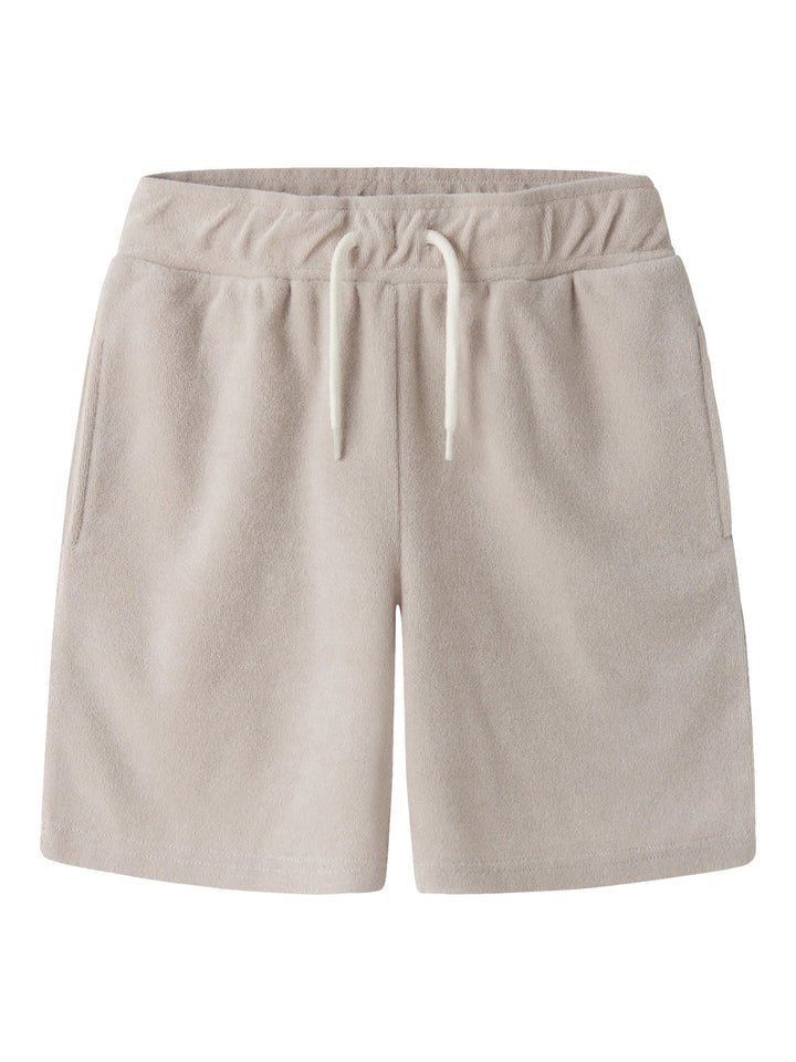 Beige mjuk och skön frotté shorts till pojke. Sköna mjuka frotte shorts till kille barn och ungdom från Name it.
NKMFINTI NREG TERRY SHORTS BOX
13257499