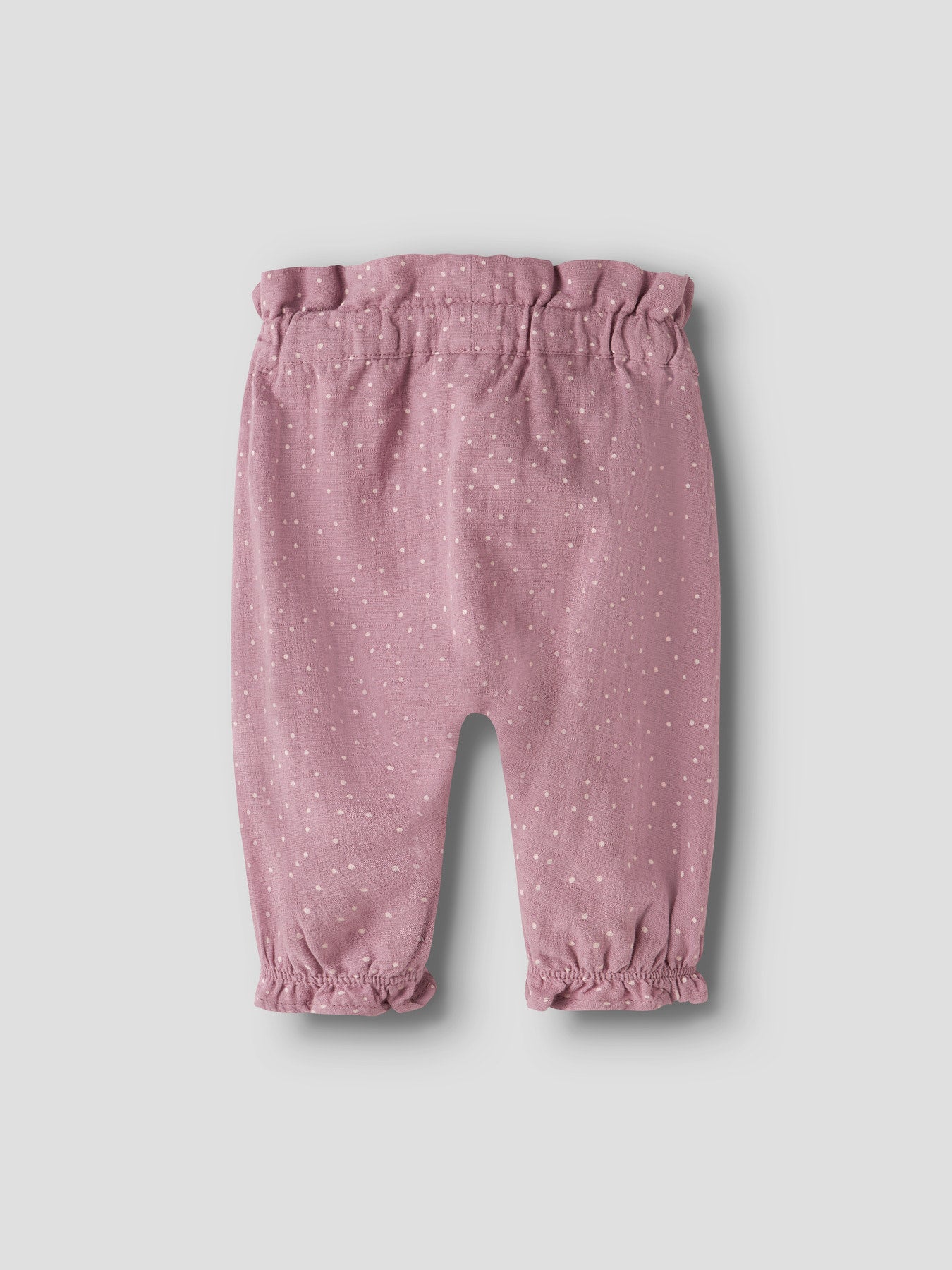 Name It Lalou byxor för babyflicka med vita prickar, rosett i midjan och volangdetaljer