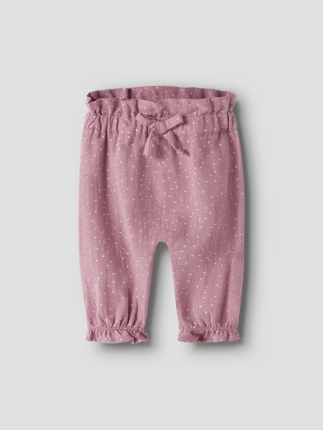 Name It Lalou byxor för babyflicka med vita prickar, rosett i midjan och volangdetaljer