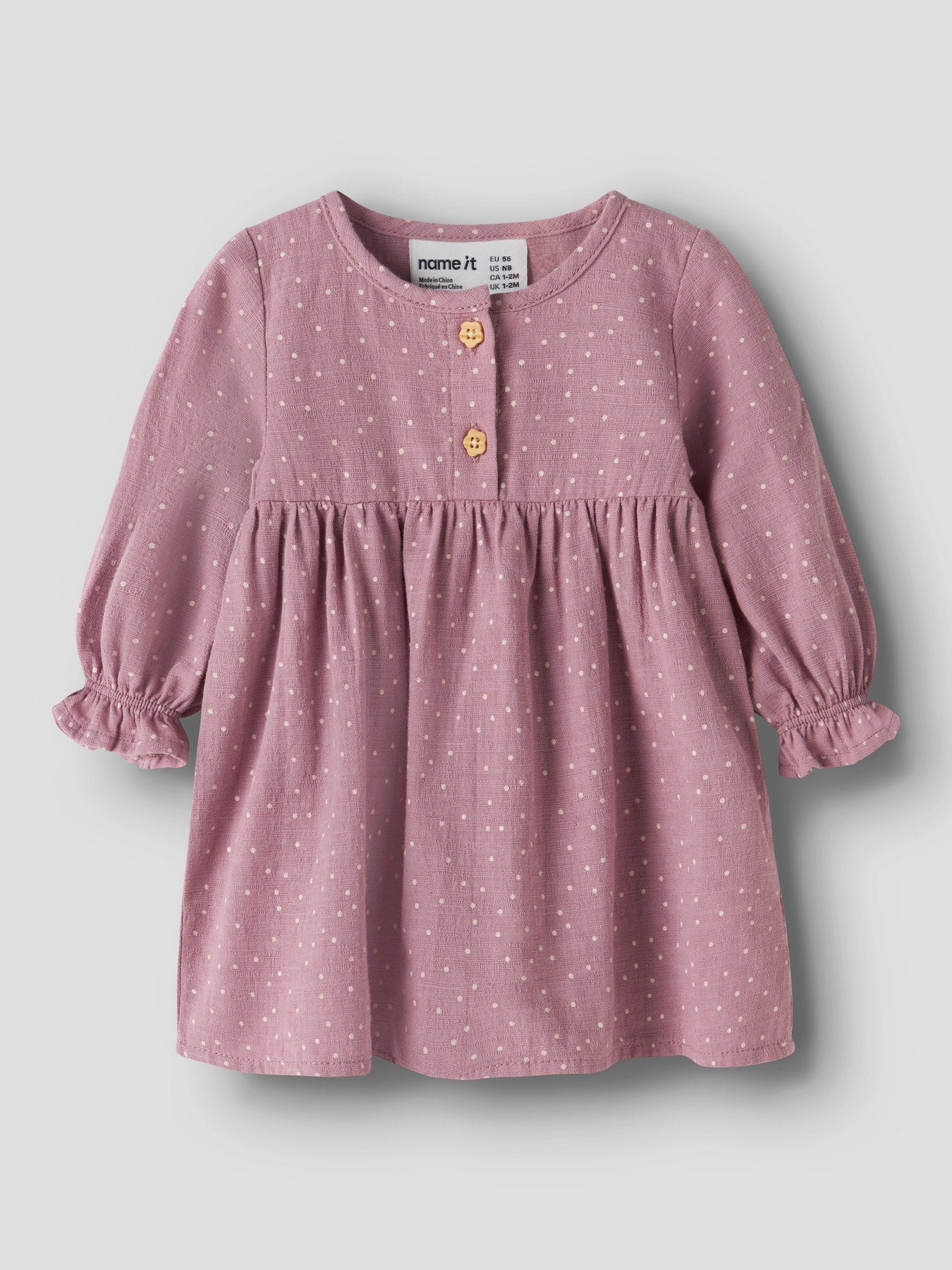Name It Lalou klänning för babyflicka med prickigt mönster, träknappar och volangärmar