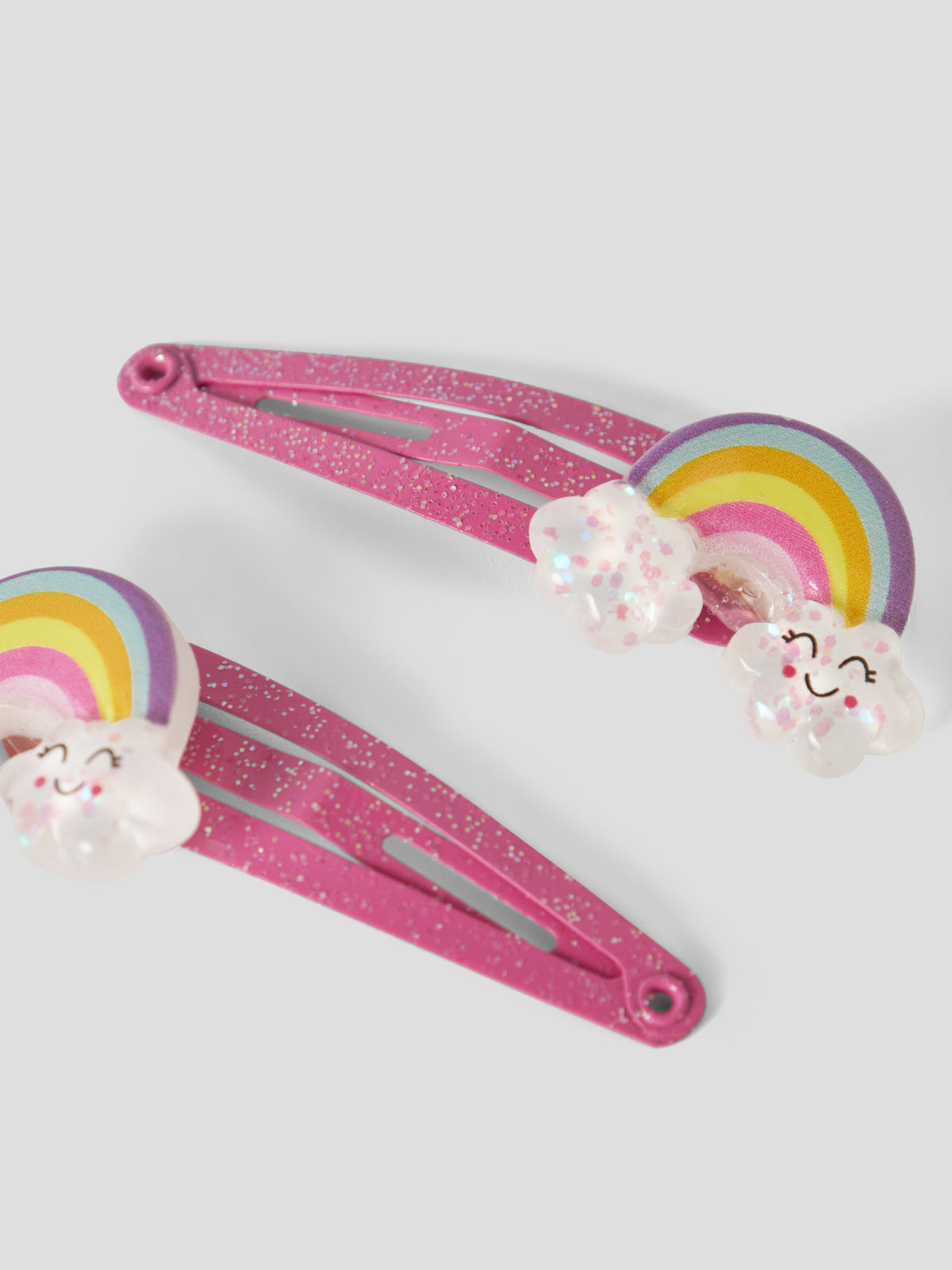 name it hårspännen 2-pack för flicka med glittrig regnbåge på rosa klickspännen.