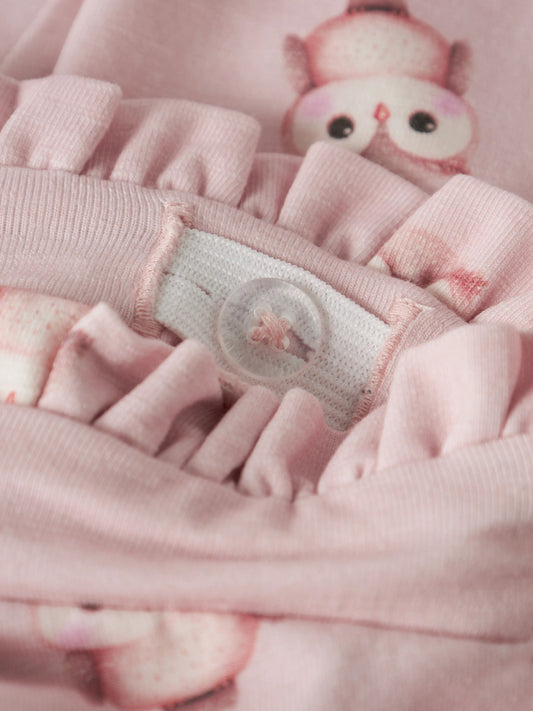 Name It Netie ljusrosa babybyxa i färgen Lotus med ugglemönster, volangmidja och rosett för flicka