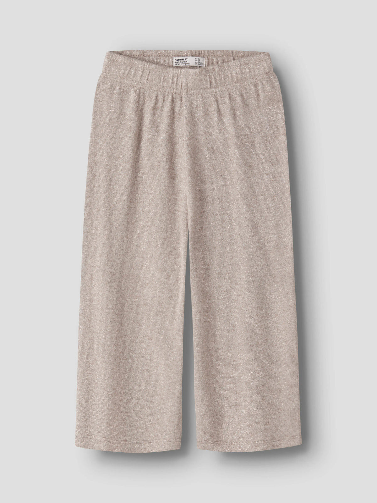 Rammi beige glitterbyxor till flicka från Name It med vida ben, framifrån