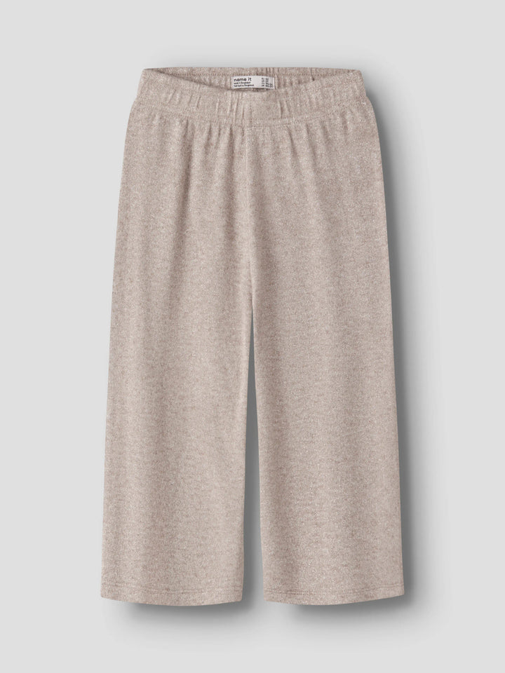 Rammi beige glitterbyxor till flicka från Name It med vida ben, framifrån