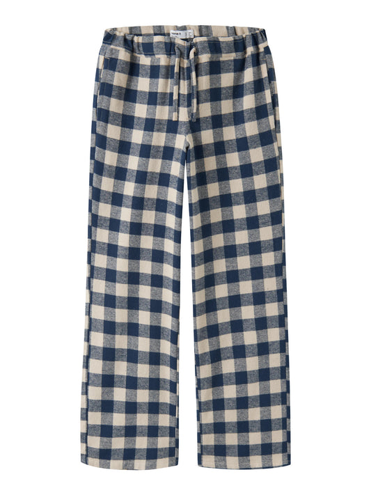 Name It Raluq rutiga flanellbyxor för pojke i mörkblått och beige med vida ben och knytband.