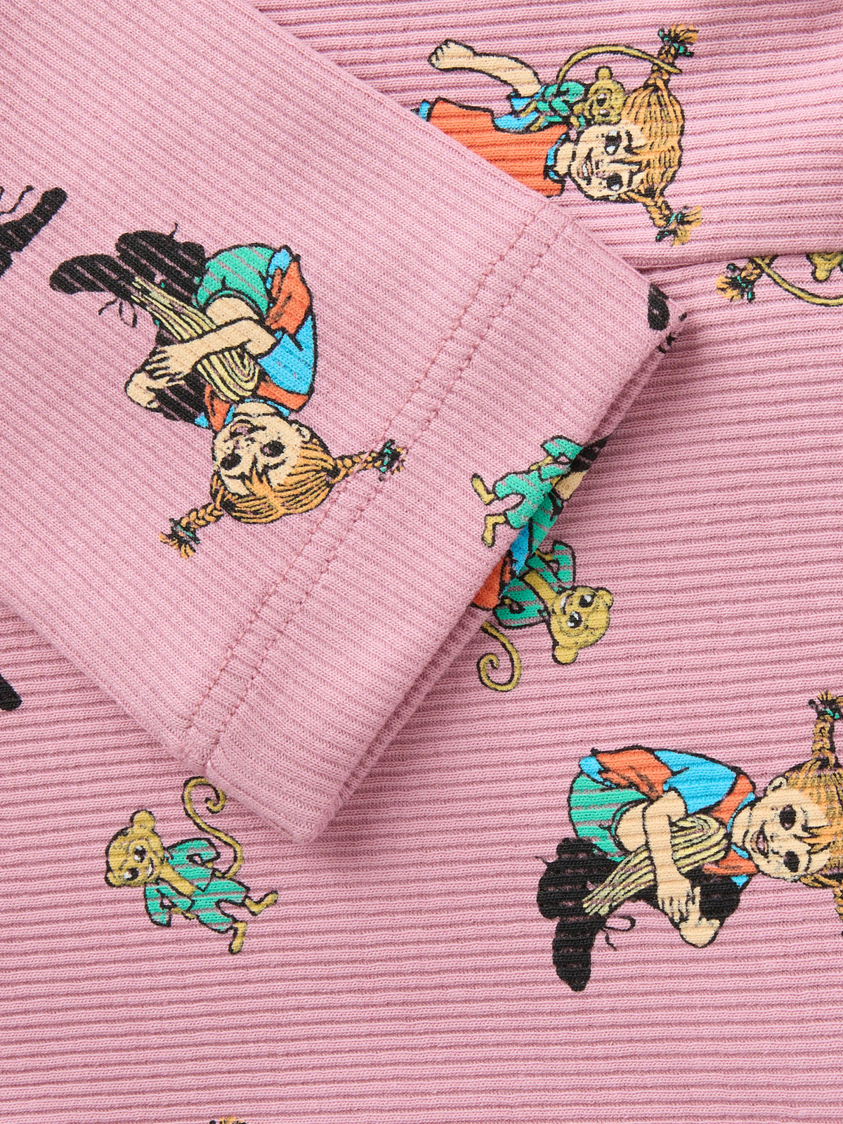 Name It Ara Pippi Långstrump leggings i rosa ribbad ekologisk bomull för flicka med Pippi-motiv.