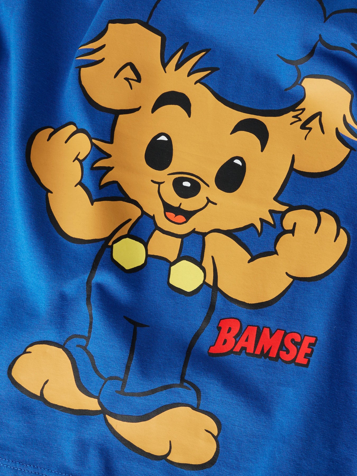 Kortärmad Bamse t-shirt i Strong Blue från Name It för pojke.