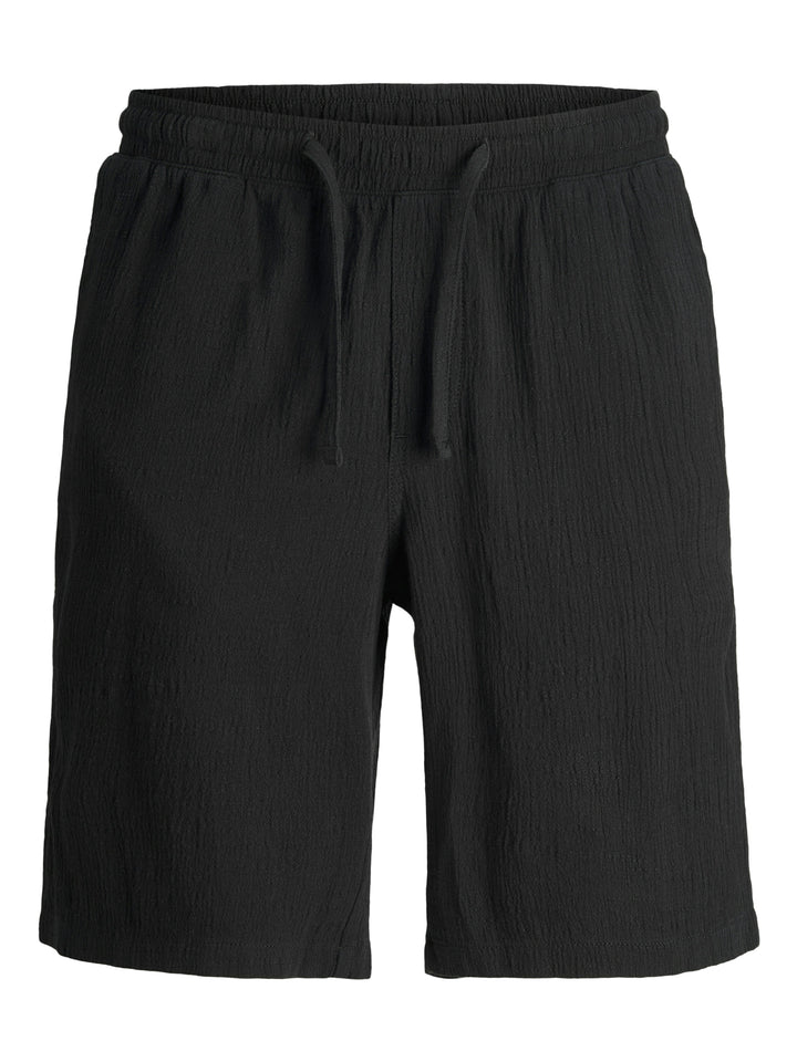 Svarta vävda skrynkliga shorts från Jack & Jones till kille ungdom.
JPSTJAIDEN JJCRINKLE JOGGER SHORT JNR
12273862