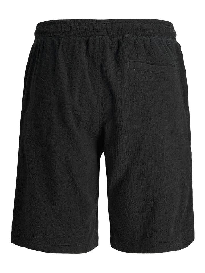 Svarta vävda skrynkliga shorts från Jack & Jones till kille ungdom.
JPSTJAIDEN JJCRINKLE JOGGER SHORT JNR
12273862