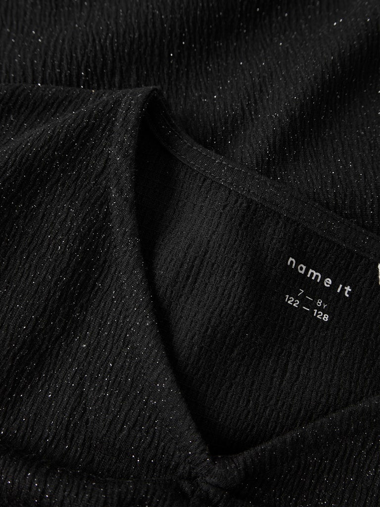 svart glittrig topp till flicka. Festkläder till tjej från Name it.
NKFODNY LS SLIM TOP
13247907