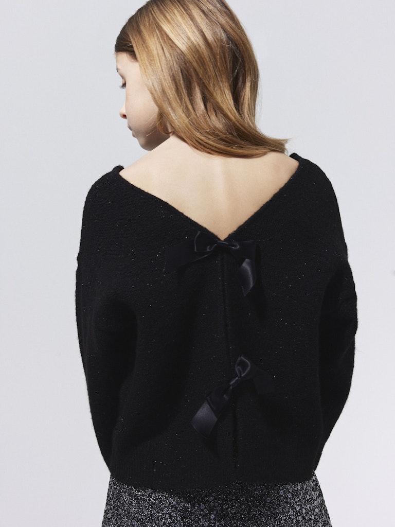 Svart festlig glitter tröja med rosetter i ryggen. Tröja till flicka, tjej barn och ungdoms kläder från Nameit.
NKFSIMRA LS SH KNIT
13250466