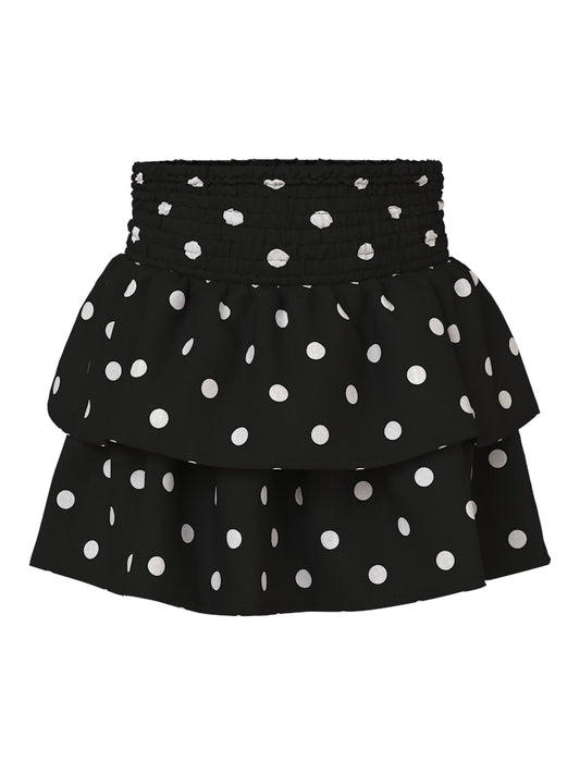 Svart volang kjol med vita prickar till flicka. Festlig kjol från Nameit.
NMFSALLIE SKIRT
13259475