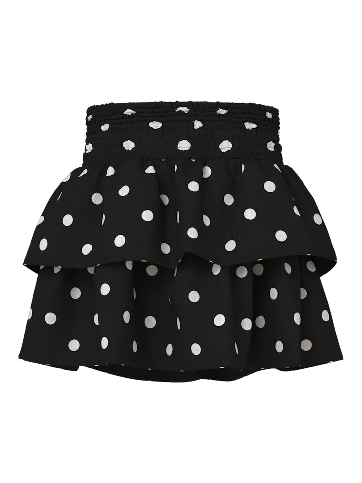 Svart volang kjol med vita prickar till flicka. Festlig kjol från Nameit.
NMFSALLIE SKIRT
13259475