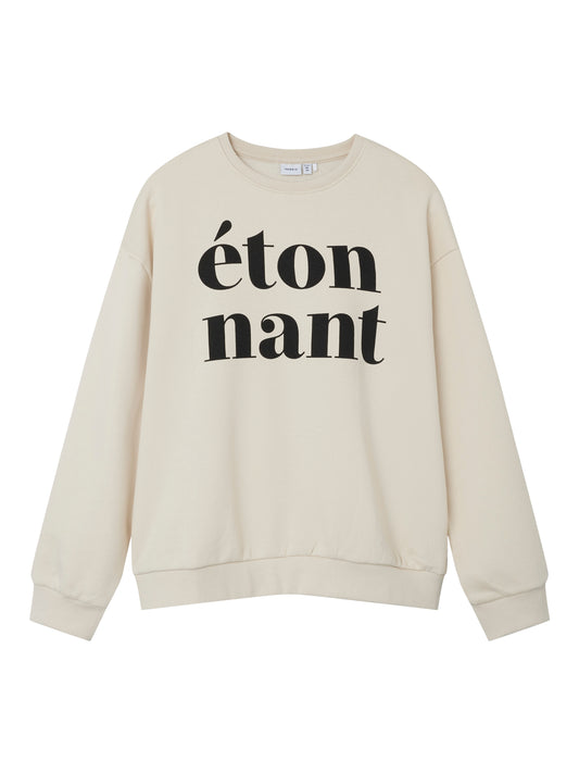 Snygg beige sweatshirt tröja i lös skön modell till flicka barn.
Ungdoms tröja till tjej i skön bomull.