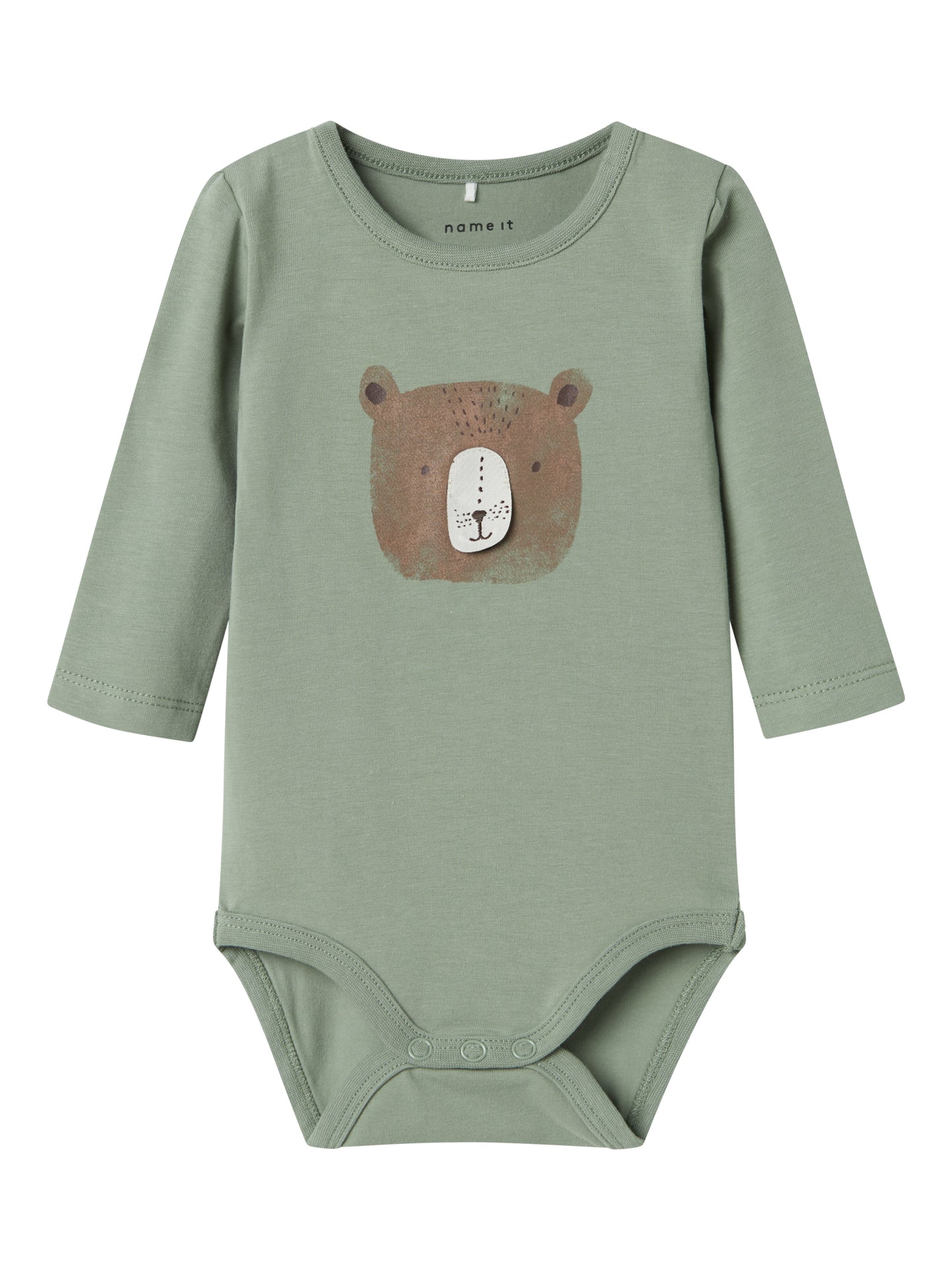 Grön body till baby med en björn på magen. Väldigt söt överdel i ekologisk bomull.

Produkttyp: Bodysuit
Hals: Rund hals
Ärm: Lång ärm
Stängning: Tryckknapp
Extra detaljer: 3D-detalj