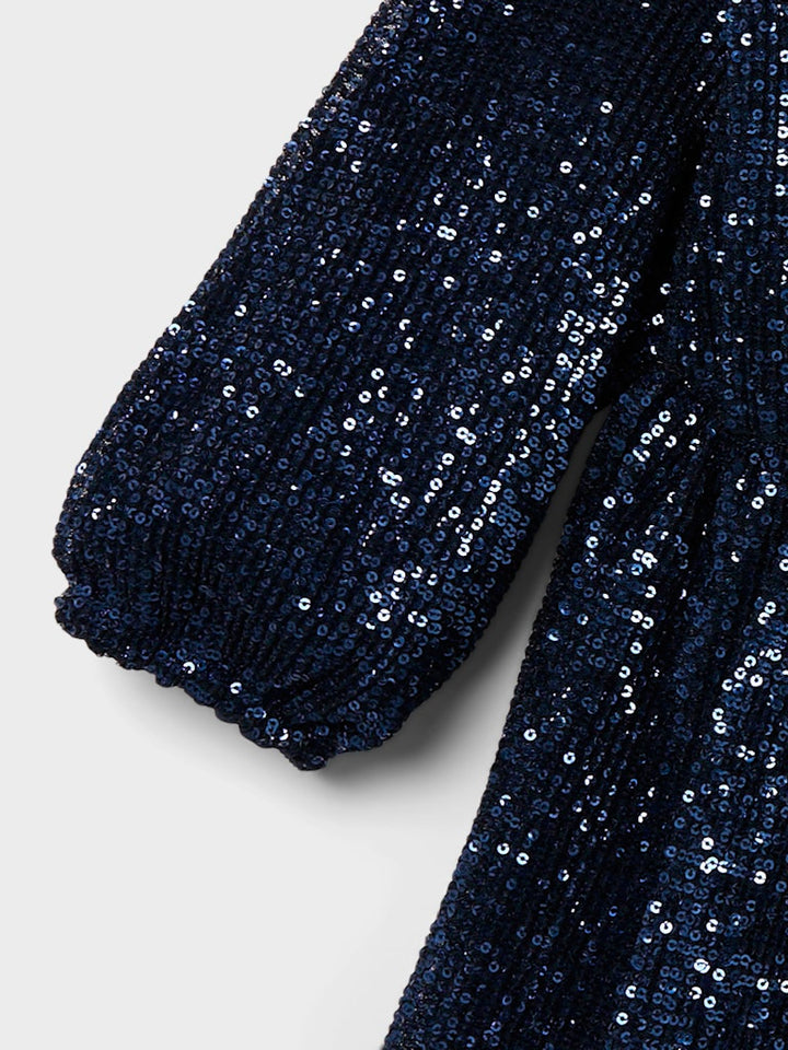 Svart långärmad paljett klänning till flicka. Festlig jul och nyårs klänning till tjej, paljettklänning från Name it.
NKFRANTELLA LS DRESS
13222691
