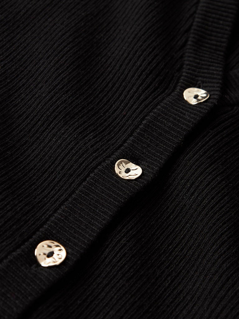 Svart fin stickad kofta till flicka. Tjej cardigan i enkel klassisk modell som passar till både vardag och fest.
NKFLARENLISE XSL LS KNIT CARD
13245597