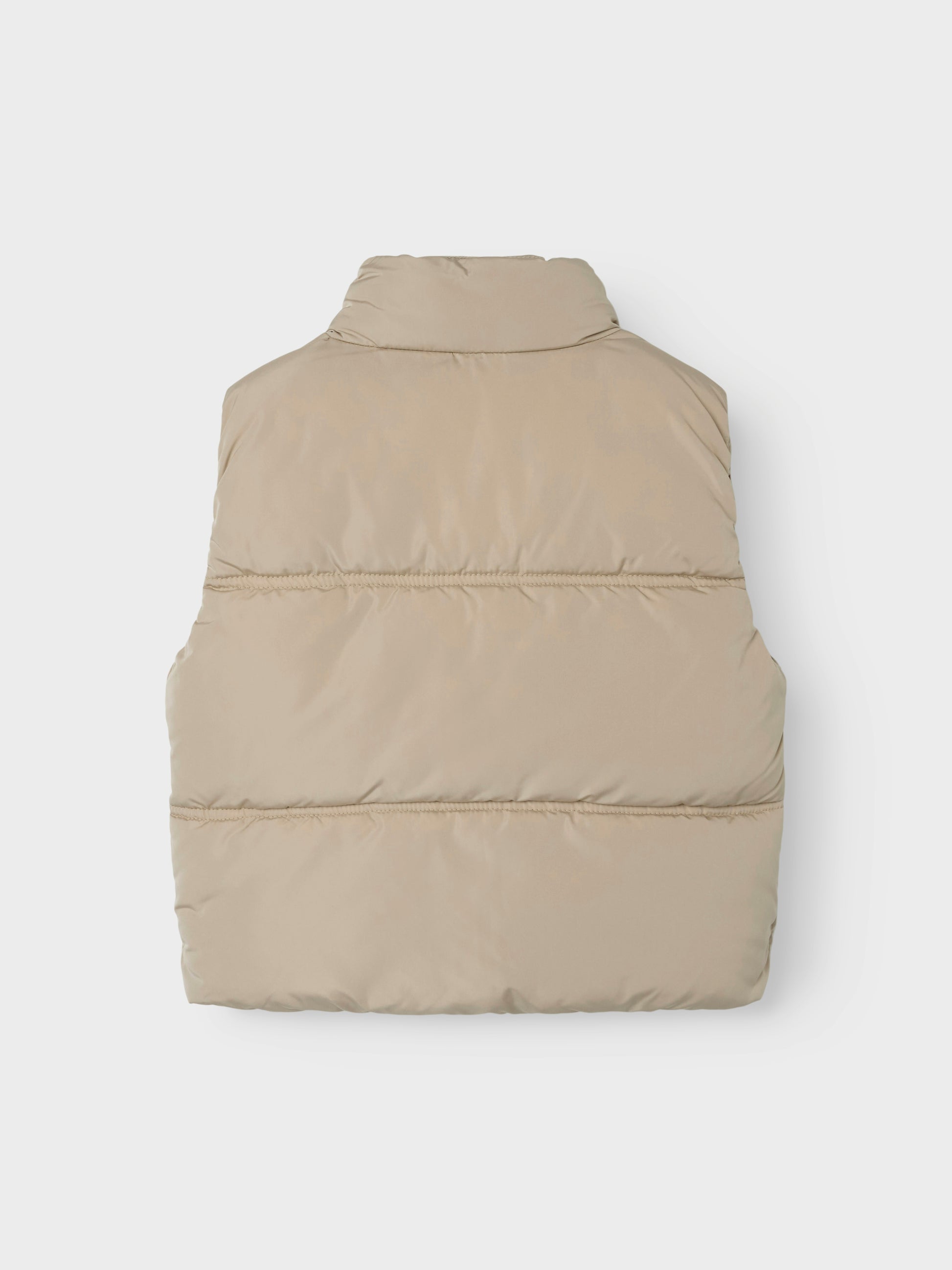 Snygg beige väst till tjej. Täckväst till flicka i återvunnen polyester från Name it.
NKFMAKET VEST NOOS
13237547