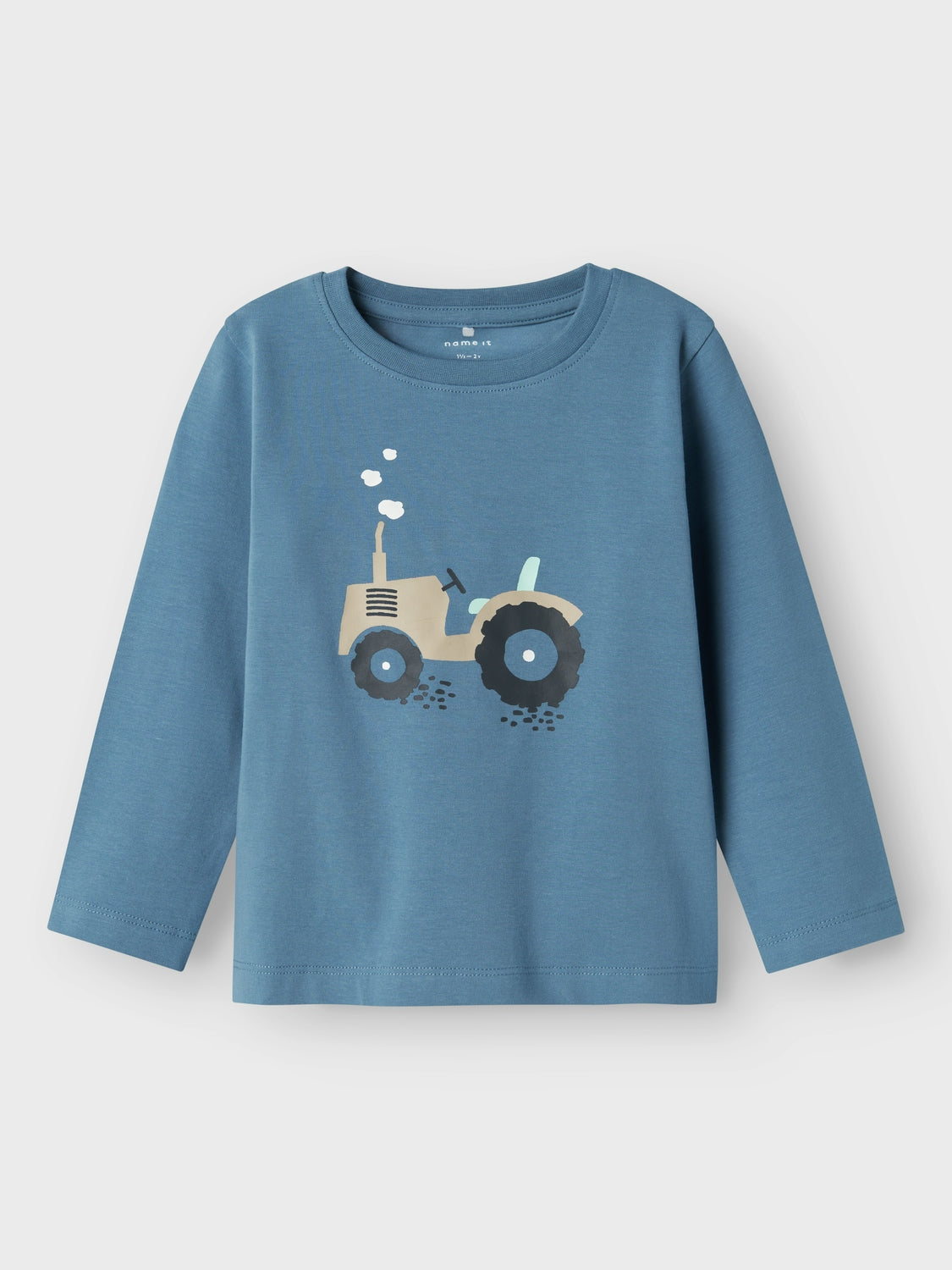 Långärmad blå t-shirt med traktor på bröstet för små pojkar
