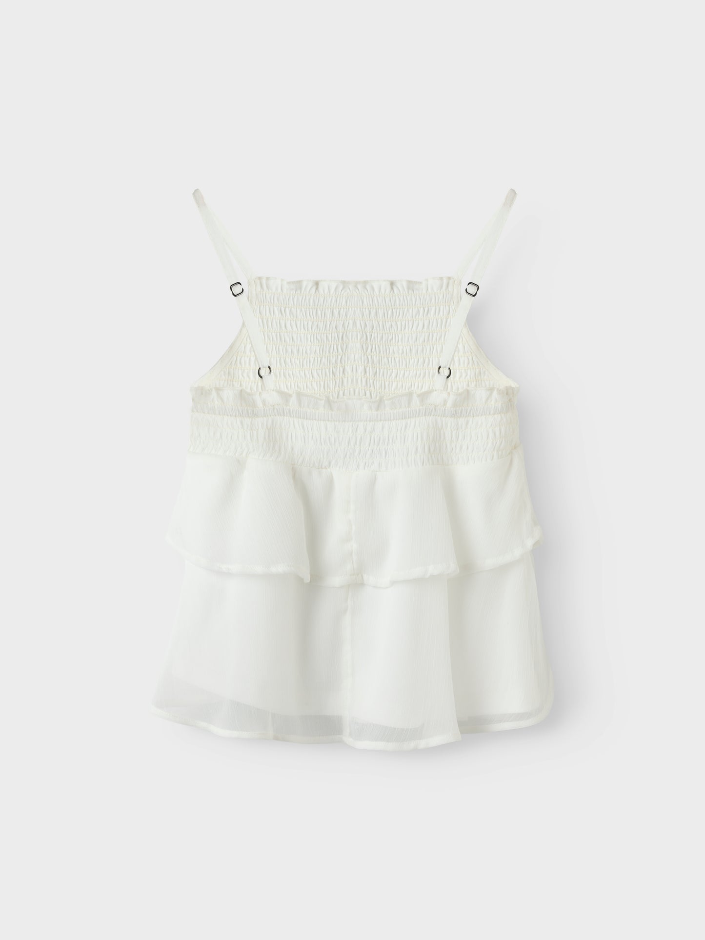Vitt linne med smala axelband till tjej. Volanger linne till flicka perfekt för stunder att vara finklädd, midsommar, skolavslutningskläder och examen från Name it.
NKFFEDOLINA STRAP TOP
13246660