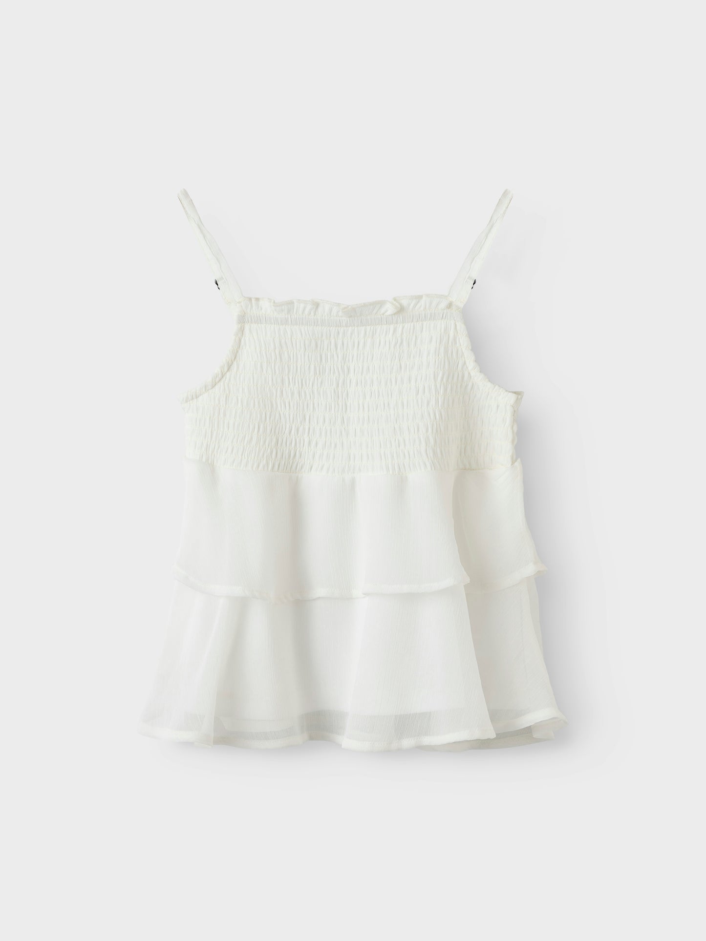 Vitt linne med smala axelband till tjej. Volanger linne till flicka perfekt för stunder att vara finklädd, midsommar, skolavslutningskläder och examen från Name it.
NKFFEDOLINA STRAP TOP
13246660