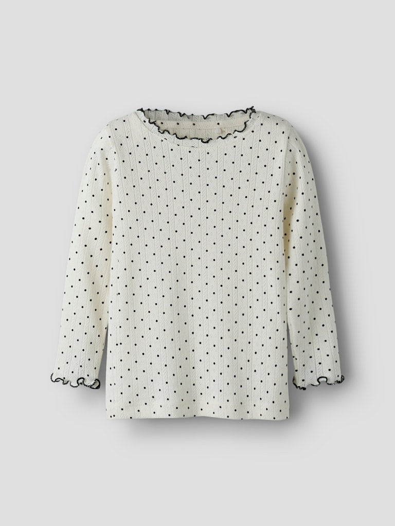 VIt svart prickig tröja till flicka. Ekologiska barnkläder från Name it, söt topp med mönstrad struktur och söta detaljer.
NMFTANIA LS SLIM TOP
13258575