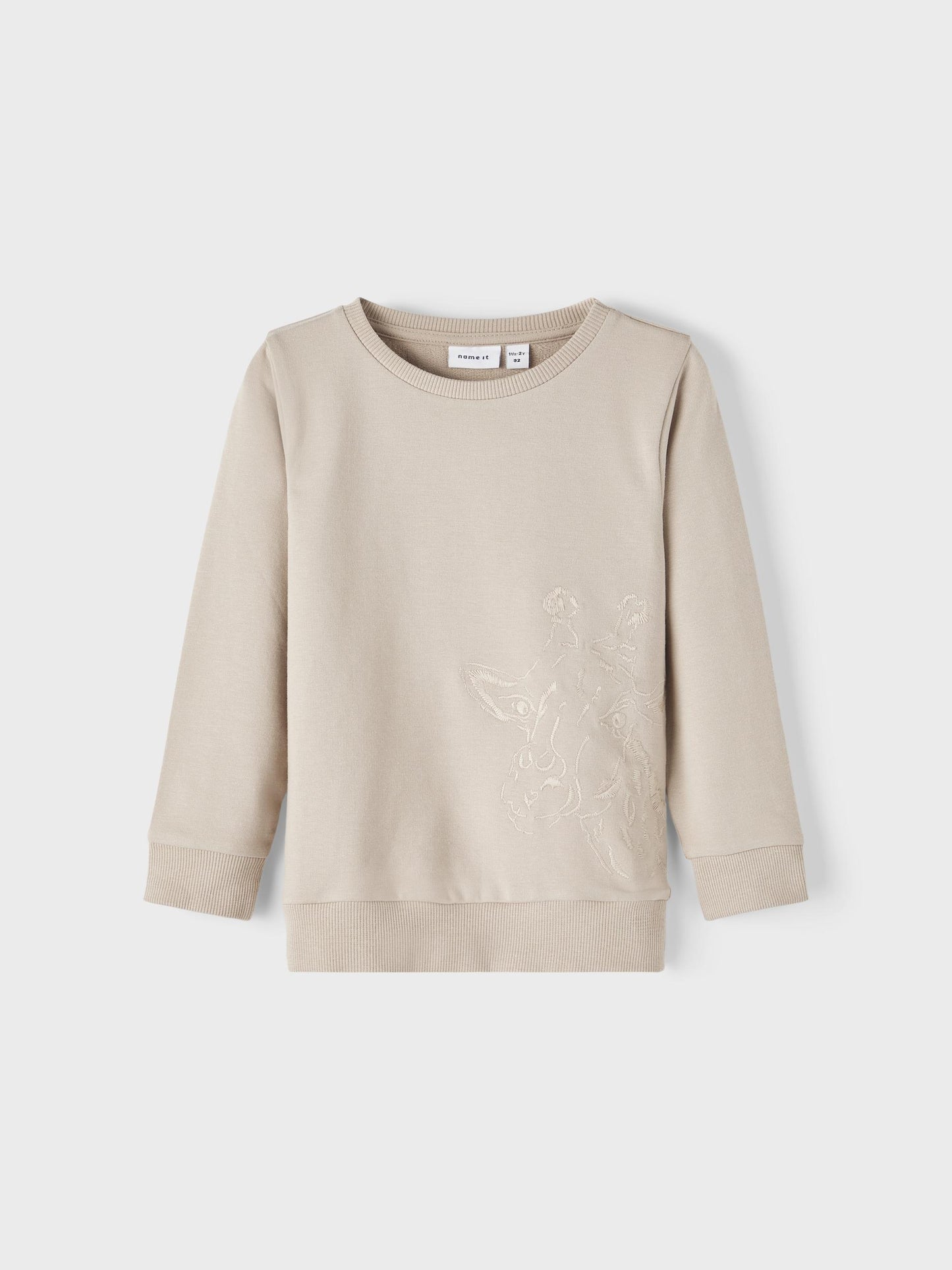 Beige tröja med giraff